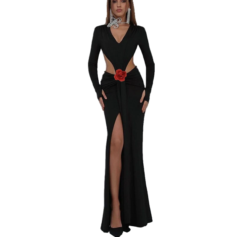 Black evening gown with a red flower detail on a white background