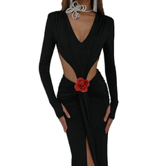 Black dress with a red flower detail on a white background