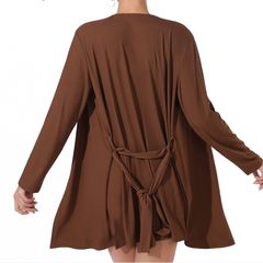 Brown dress with long sleeves and a tie detail on a white background