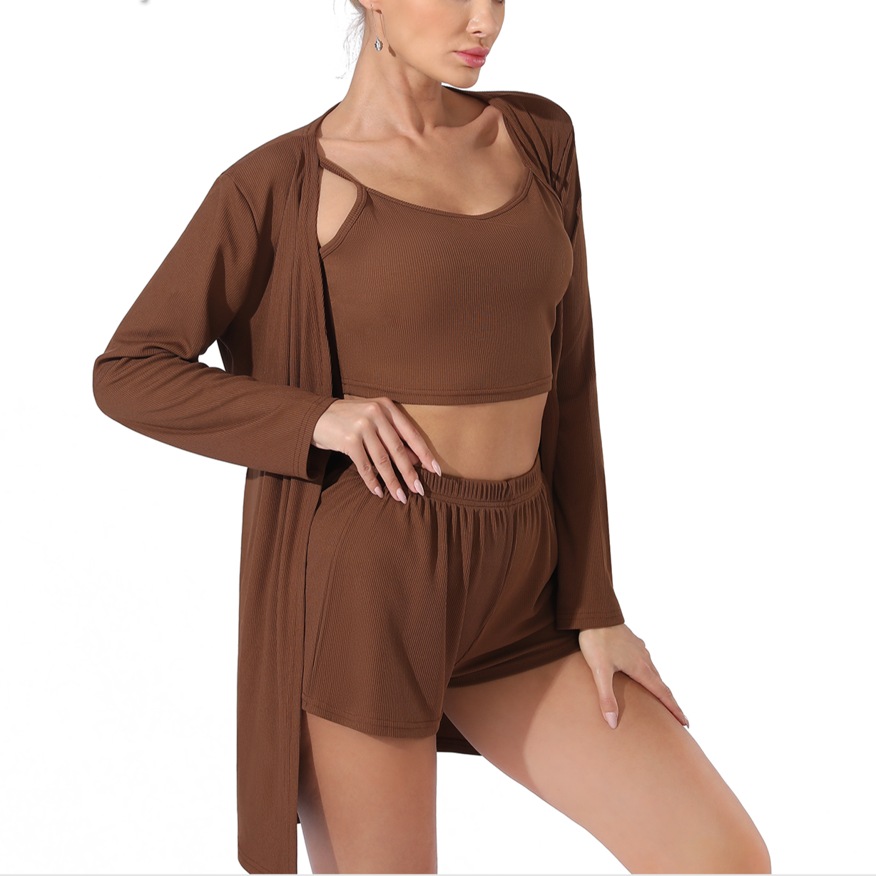 Woman wearing a brown outfit with a long cardigan on a white background