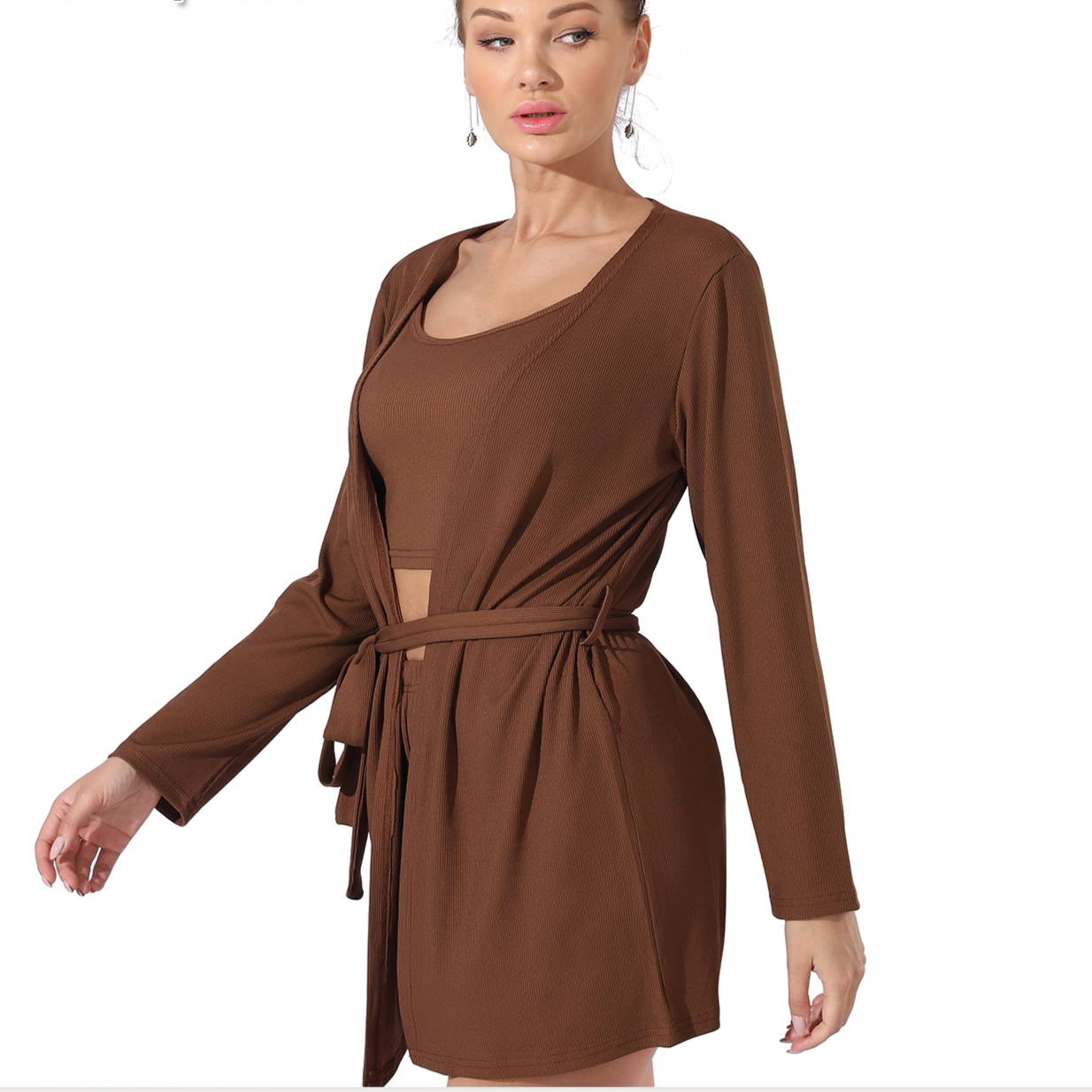 Woman wearing a brown dress with a belt on a white background